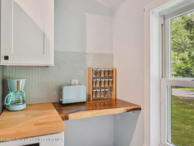 a room with furniture and a window