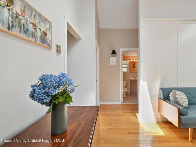 a vase with flowers sitting on a table
