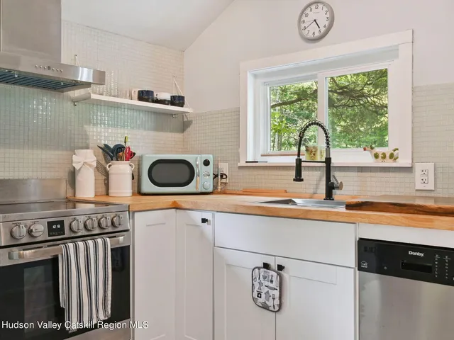 a kitchen with a stove and a sink