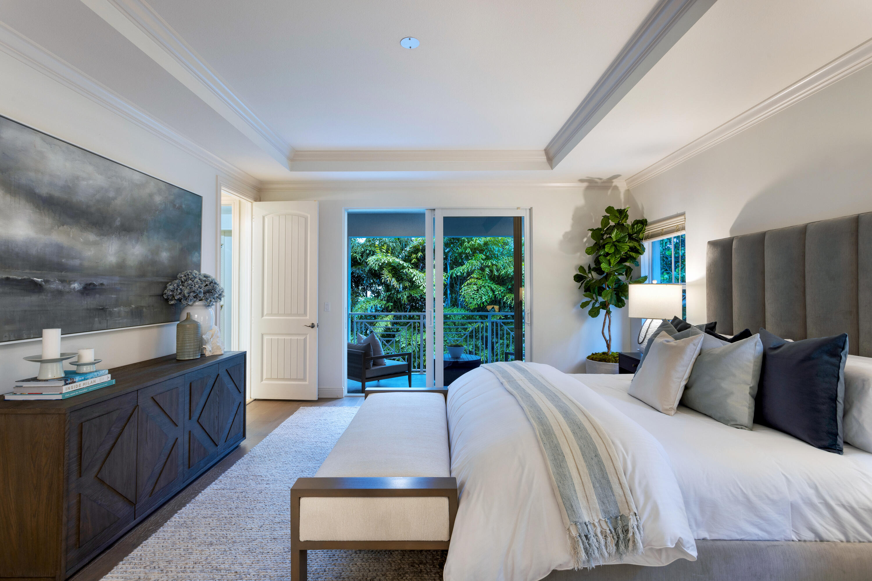 391 East Boca Raton Road Boca Raton, FL 33432 - Photo 15 of 26 a bedroom with a bed and large windows
