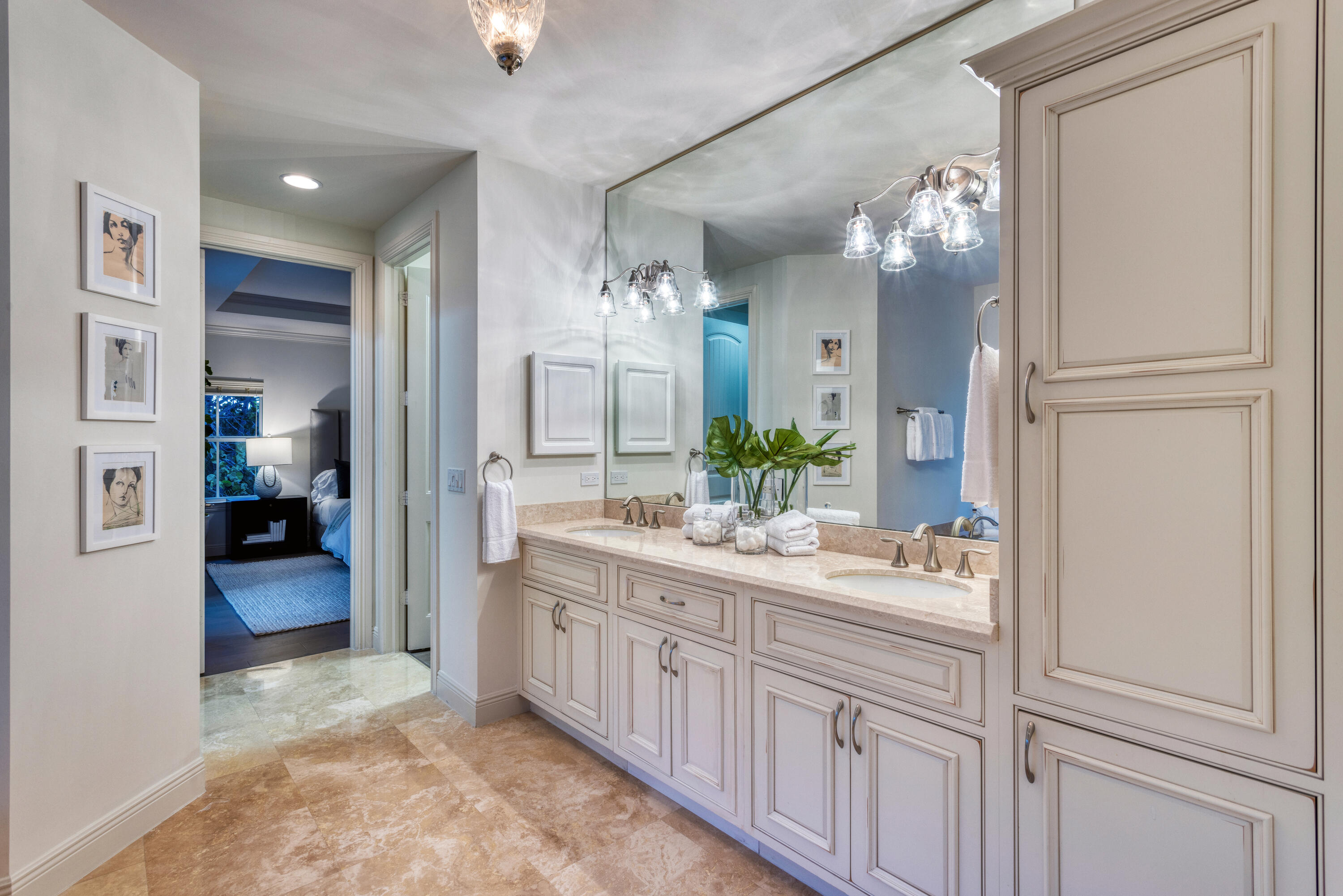 391 East Boca Raton Road Boca Raton, FL 33432 - Photo 18 of 26 a spacious bathroom with a double vanity sink and a mirror