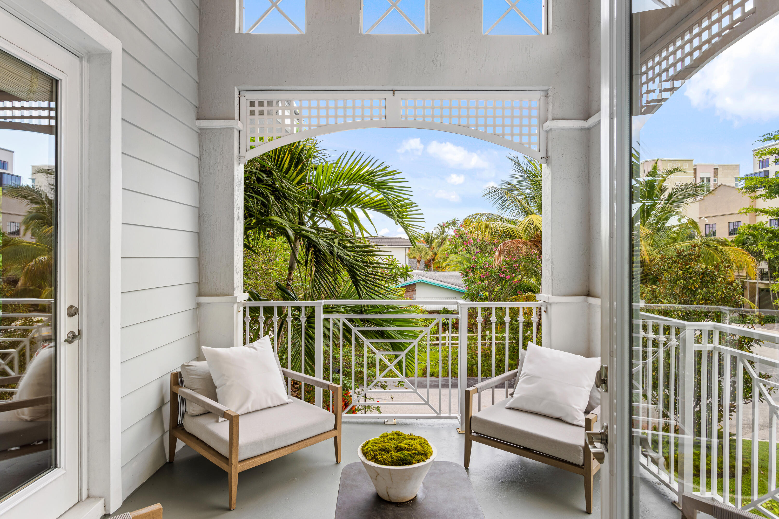 391 East Boca Raton Road Boca Raton, FL 33432 - Photo 20 of 26 a balcony with furniture and a potted plant