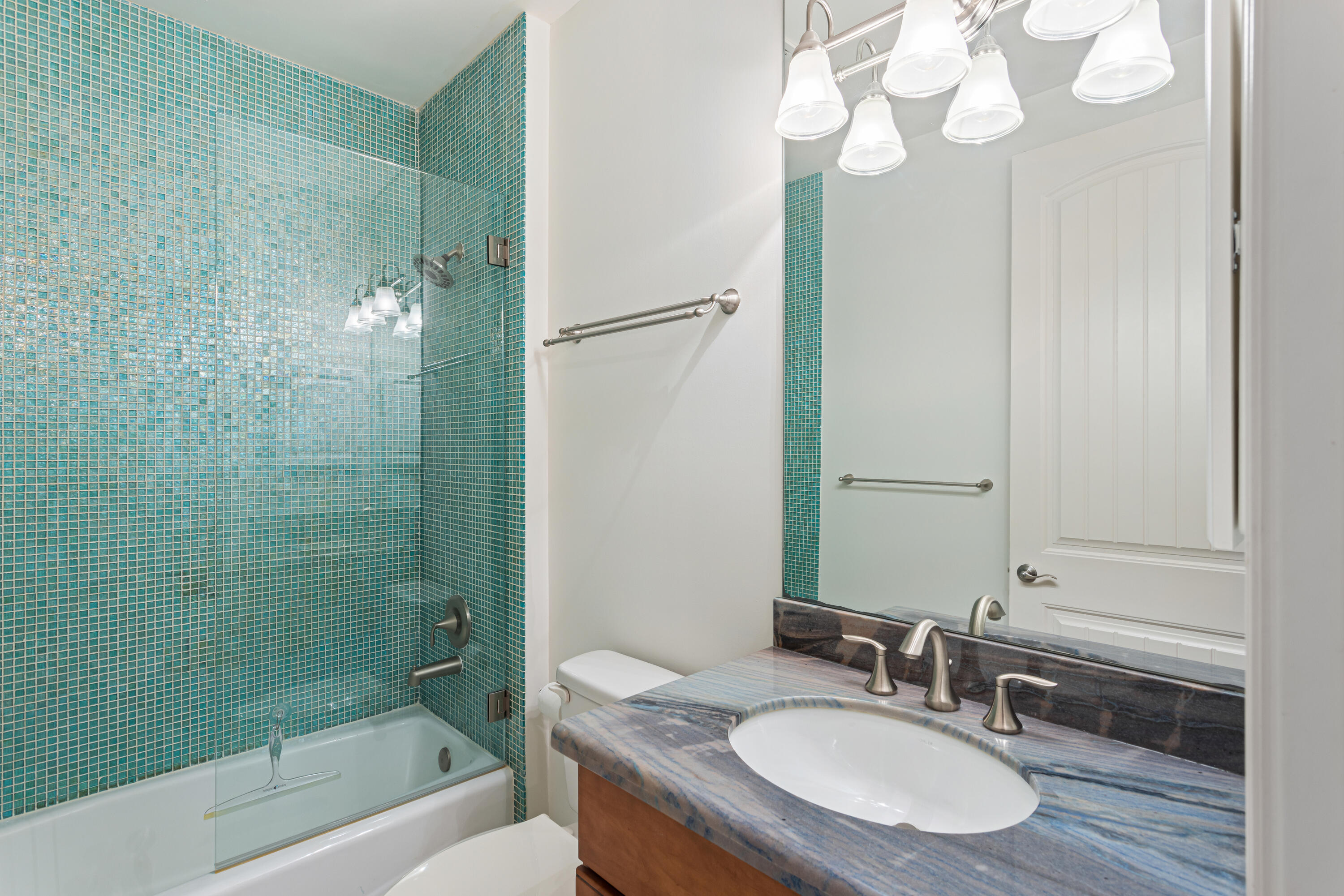 391 East Boca Raton Road Boca Raton, FL 33432 - Photo 22 of 26 a bathroom with a granite countertop sink a toilet and shower