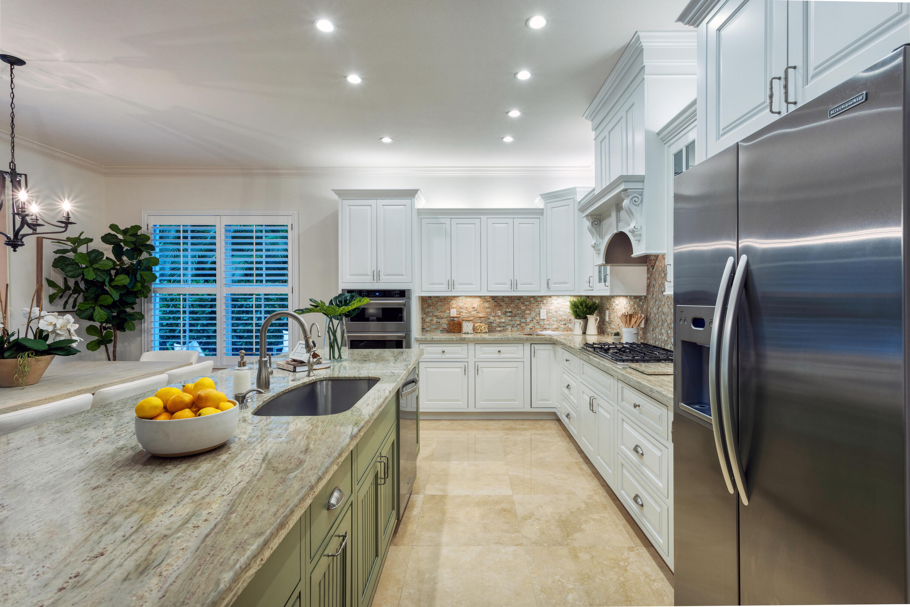 391 East Boca Raton Road Boca Raton, FL 33432 - Photo 6 of 26 a kitchen with stainless steel appliances granite countertop a sink a stove and a refrigerator
