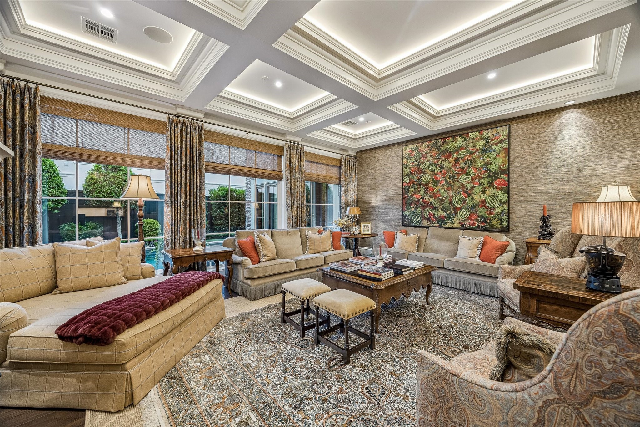 2158 Chilton Road Houston, TX 77019 - Photo 13 of 50 Flooded with natural light, the family room blends sophistication and ease with elegant finishes and poolside views. Thoughtfully connected living spaces make it ideal for hosting and daily living alike.
