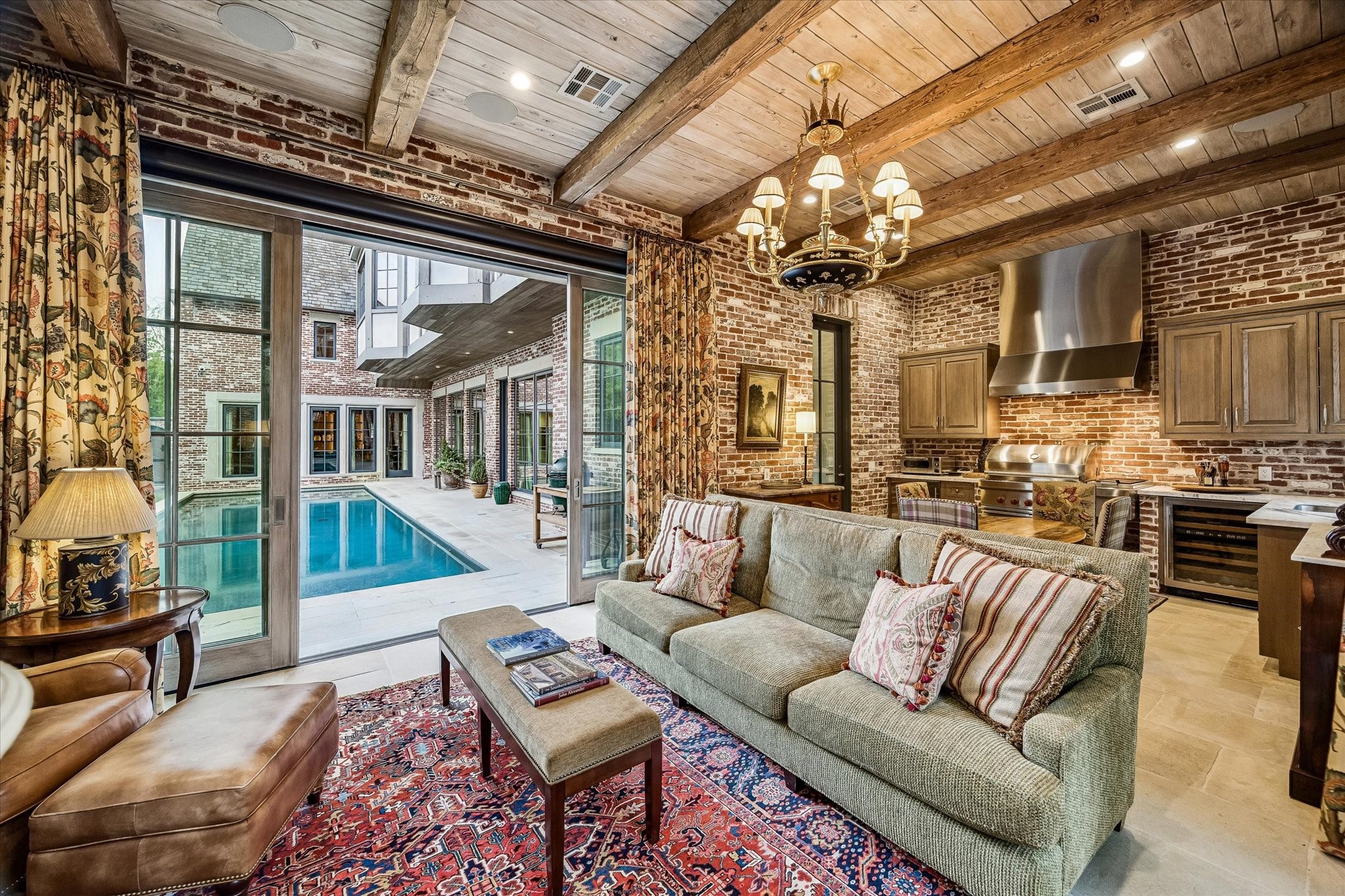 2158 Chilton Road Houston, TX 77019 - Photo 24 of 50 A beautifully designed retreat with Segreto plaster walls and ceiling, the Four Seasons room captures serene garden and pool views. Complete with a fireplace and full-service kitchen, it’s ideal for both casual gatherings and elevated hosting.