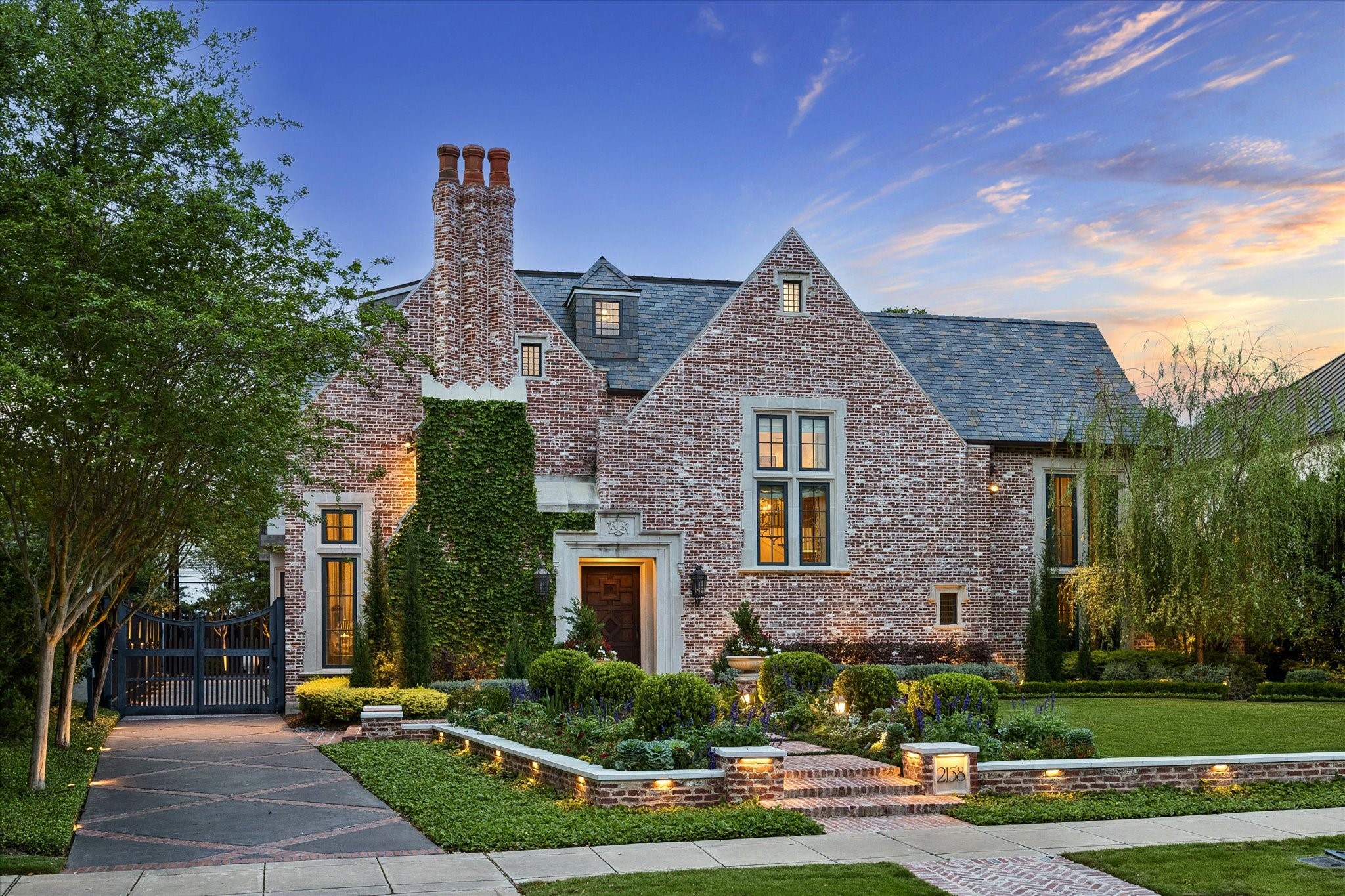 2158 Chilton Road Houston, TX 77019 - Photo 3 of 50 A striking River Oaks residence featuring a steel driveway gate, hand-laid brick hardscaping, and meticulously maintained grounds. This 5-bedroom, 5.3-bath home perfectly balances curb appeal and refined sophistication.