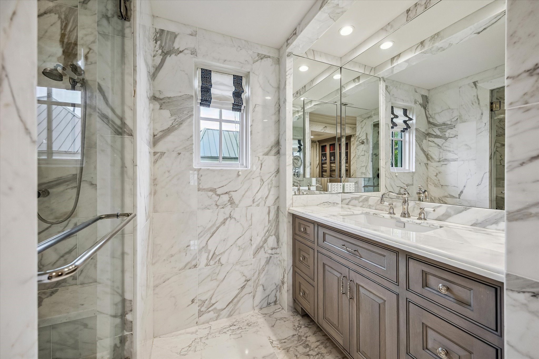 2158 Chilton Road Houston, TX 77019 - Photo 33 of 50 The primary bathroom is a spa-inspired sanctuary with marble heated floors, a soaking tub, and a steam shower with dual shower heads and body jets. Dual vanities and designer lighting create both beauty and functionality.