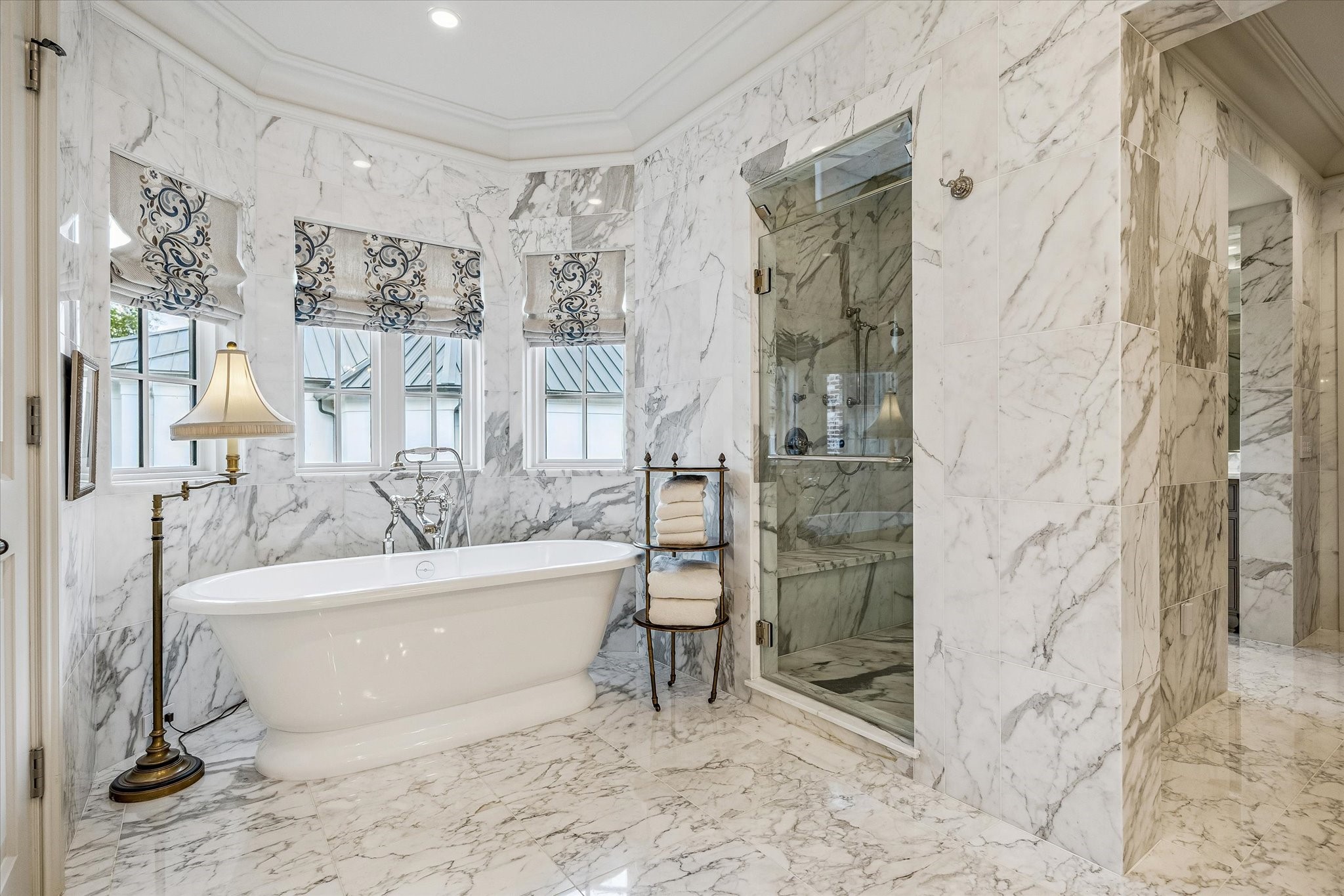 2158 Chilton Road Houston, TX 77019 - Photo 34 of 50 Designed for luxury, the primary bath boasts a steam shower, soaking tub, and abundant storage in vanities and cabinetry. Marble wainscoting and designer wallpaper complete this serene retreat.