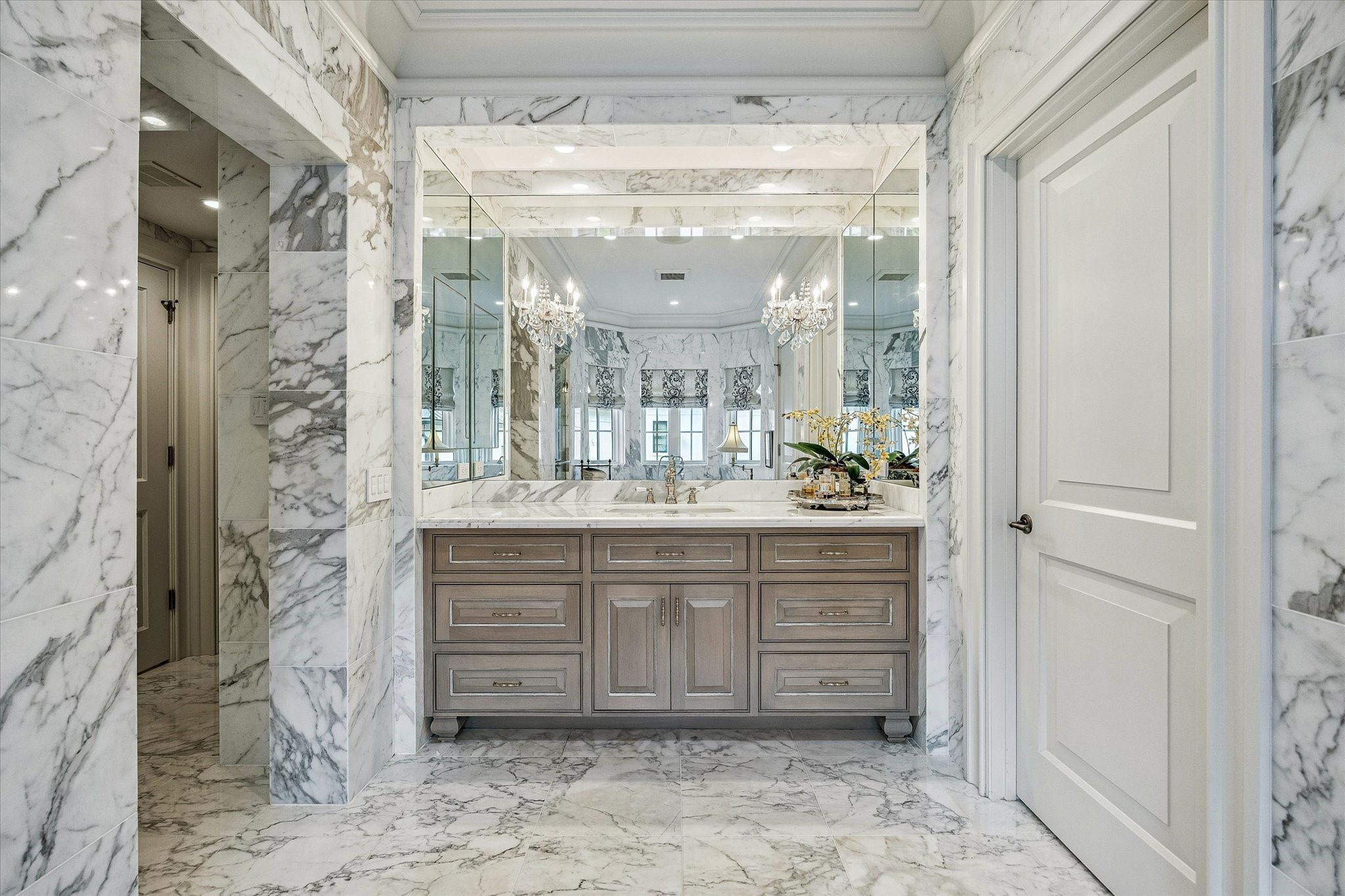2158 Chilton Road Houston, TX 77019 - Photo 35 of 50 Sophisticated finishes abound in this marble-clad bathroom, featuring Toto bidets, decorative wallpaper, and recessed ceiling speakers. Two separate water closets provide privacy and convenience.