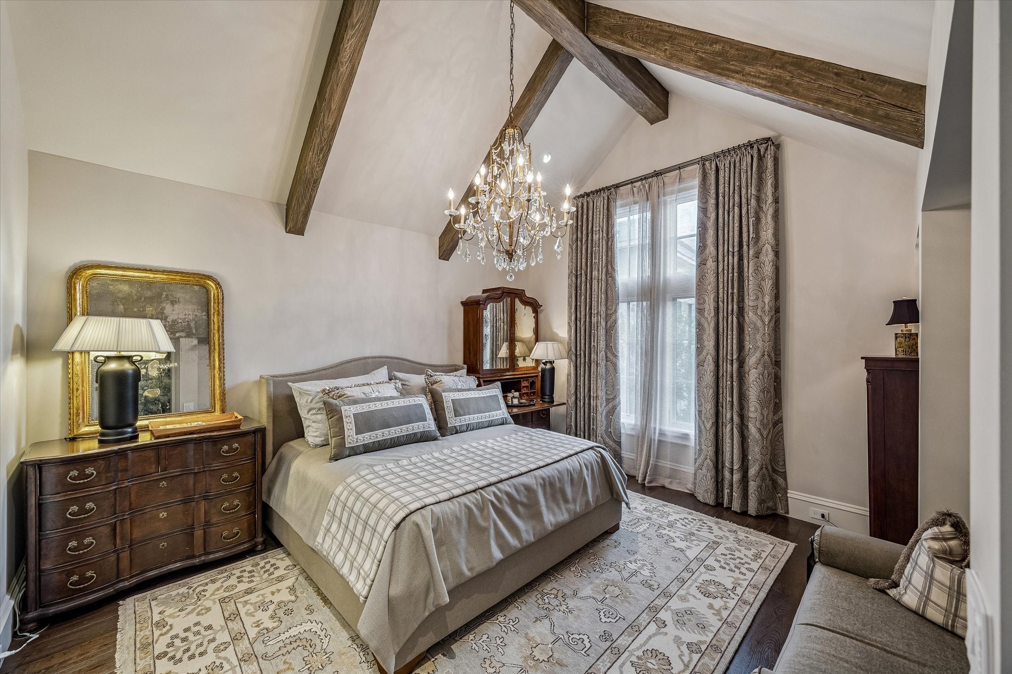 2158 Chilton Road Houston, TX 77019 - Photo 38 of 50 Guest Bedroom No. 2 features vaulted ceilings, warm hardwood floors, and custom lighting. A walk-in closet and en-suite bathroom provide comfort and convenience for guests.