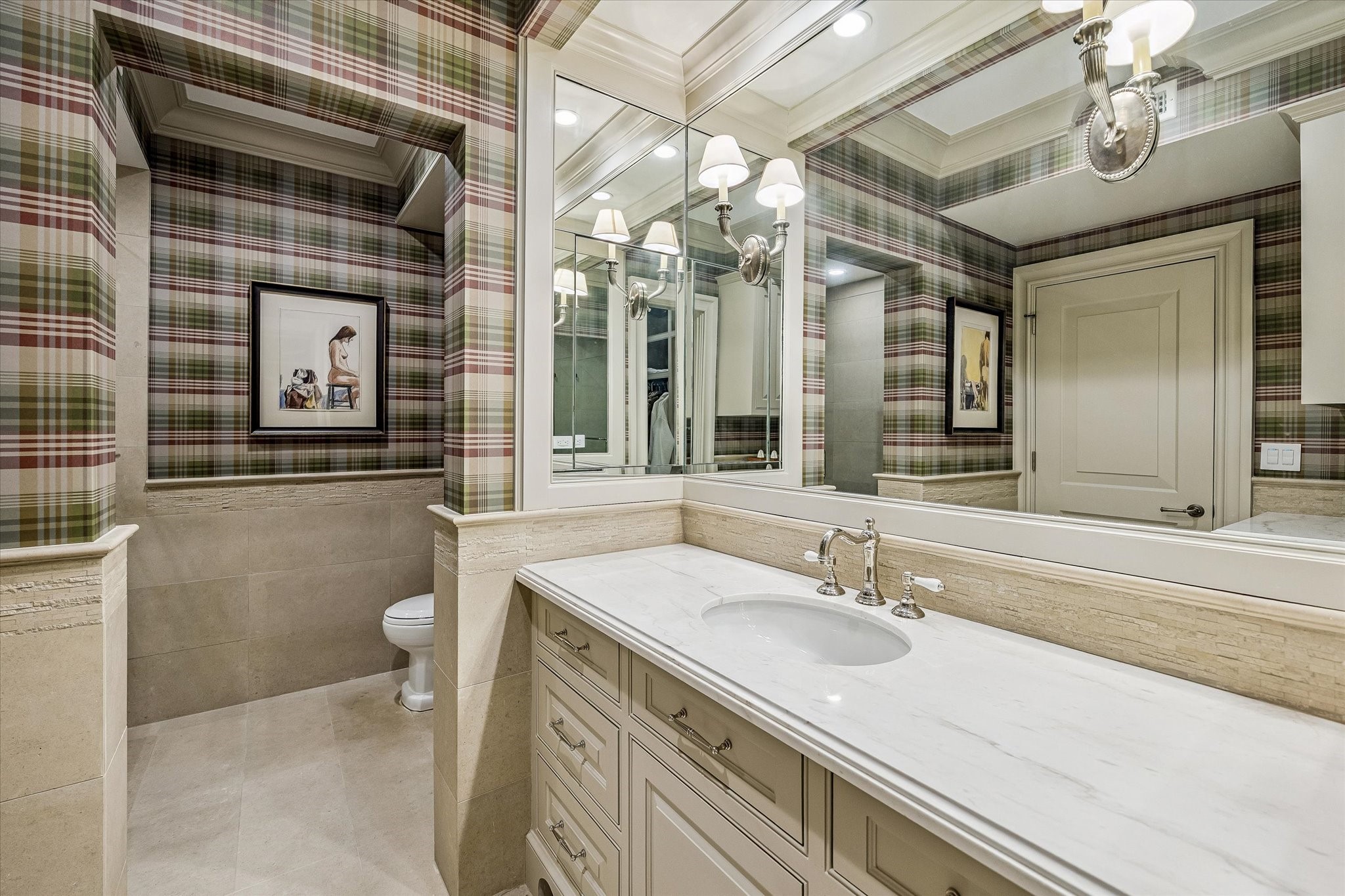 2158 Chilton Road Houston, TX 77019 - Photo 39 of 50 This bathroom blends elegance and functionality with marble countertops, a tile bath/shower, polished nickel fixtures, and plaid designer wallcovering. Crown molding adds a refined touch.
