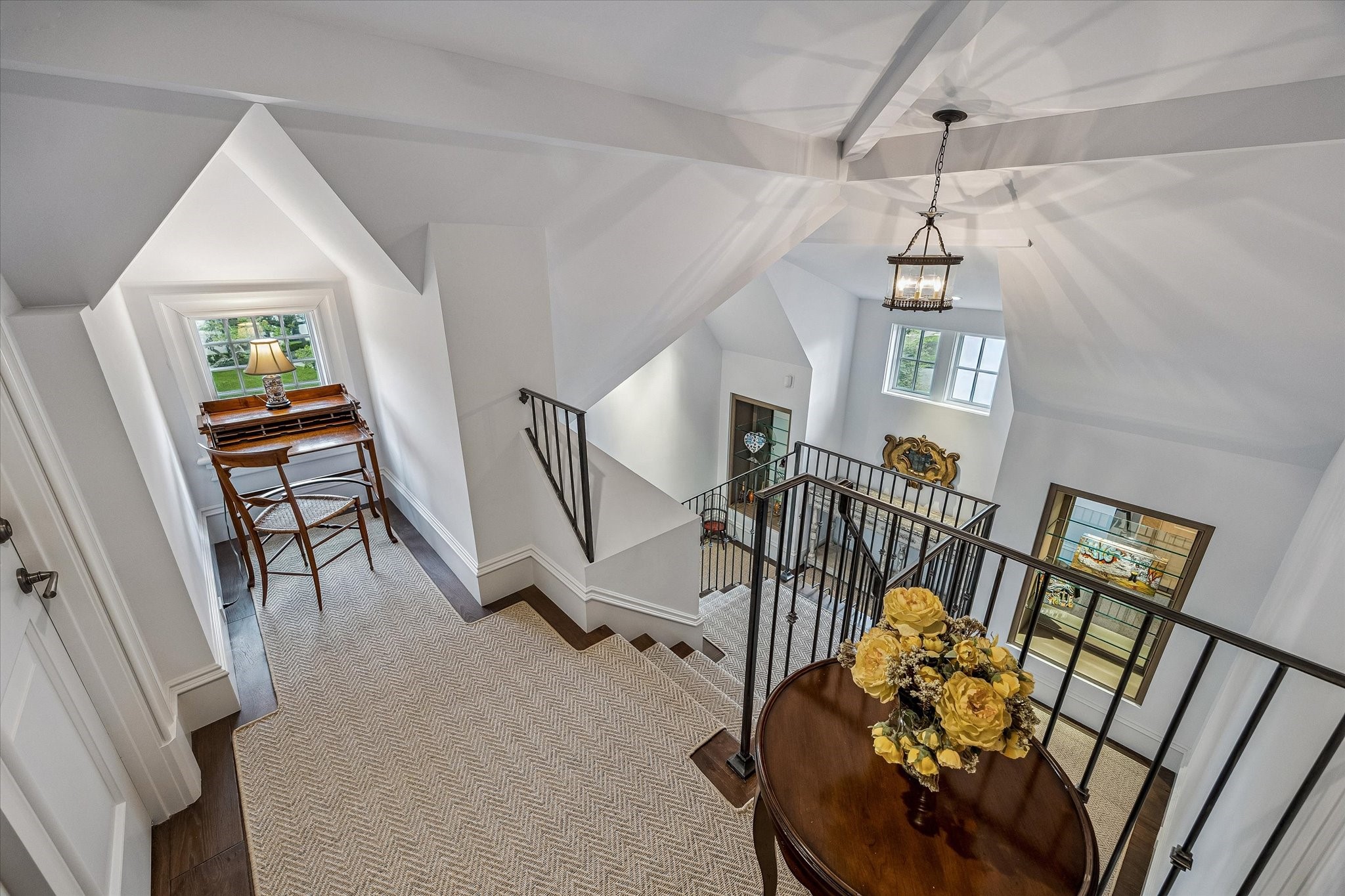 2158 Chilton Road Houston, TX 77019 - Photo 44 of 50 Ascend to the third floor to discover a versatile office space, Guest Bedroom No. 4, a wet bar, and the bunk room—perfectly designed for flexibility, comfort, and entertainment. This level offers private retreats and functional spaces for family and guests alike.