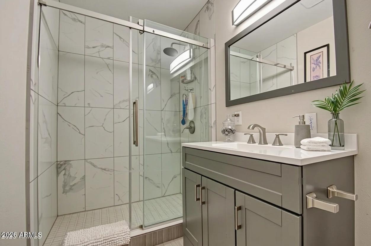 11451 East Broadway Road Mesa, AZ 85208 - Photo 13 of 24 a bathroom with a sink and mirror