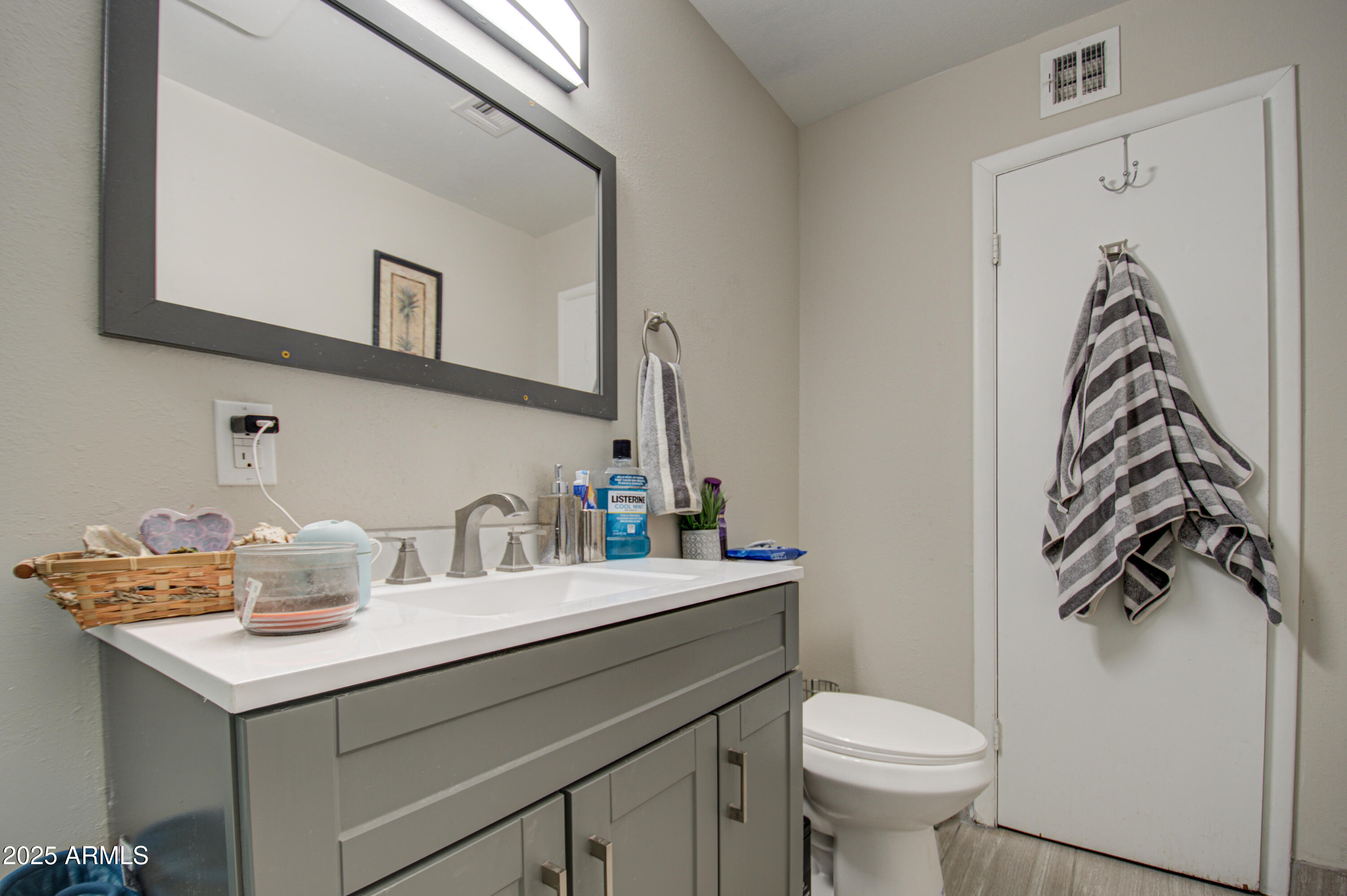 11451 East Broadway Road Mesa, AZ 85208 - Photo 14 of 24 a bathroom with a sink and a toilet