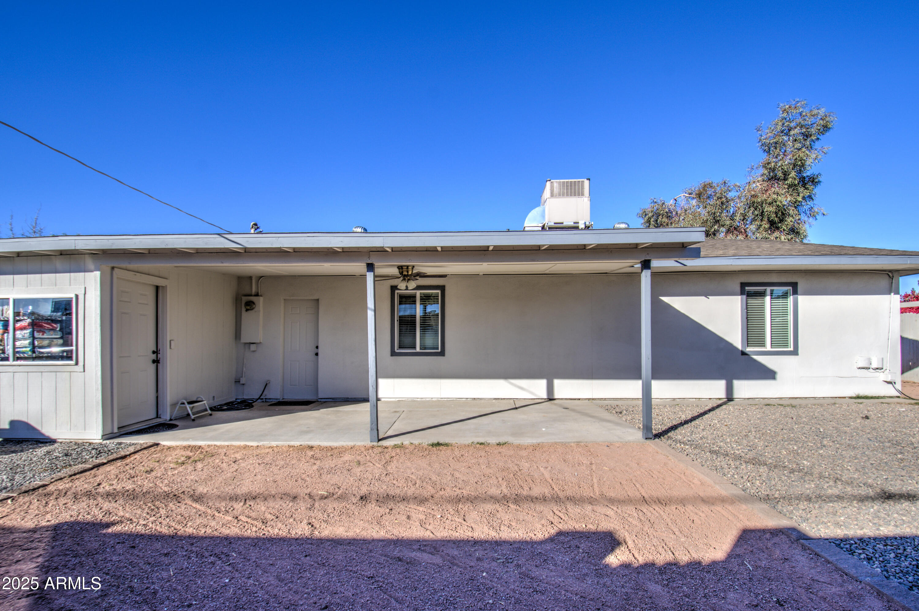 11451 East Broadway Road Mesa, AZ 85208 - Photo 22 of 24 a view of a house with a garage