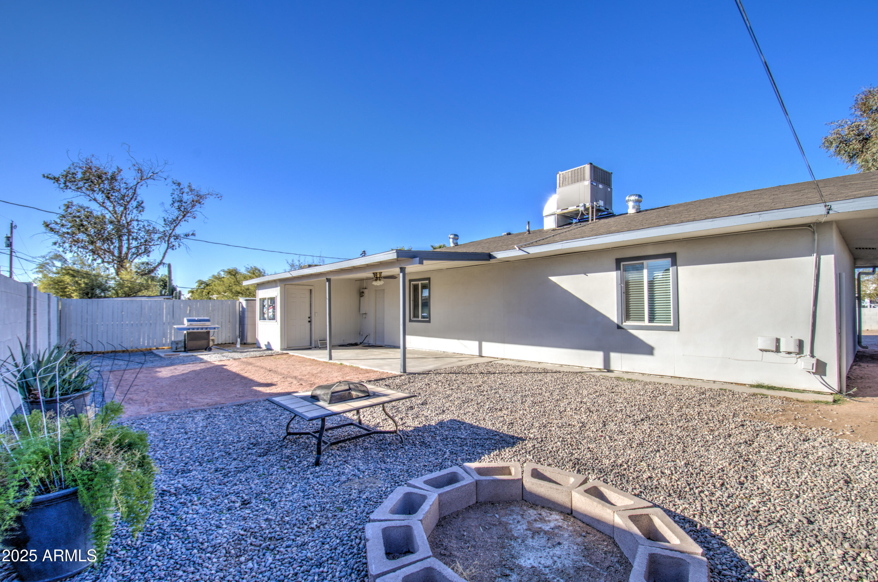 11451 East Broadway Road Mesa, AZ 85208 - Photo 23 of 24 a view of a house with backyard and sitting area