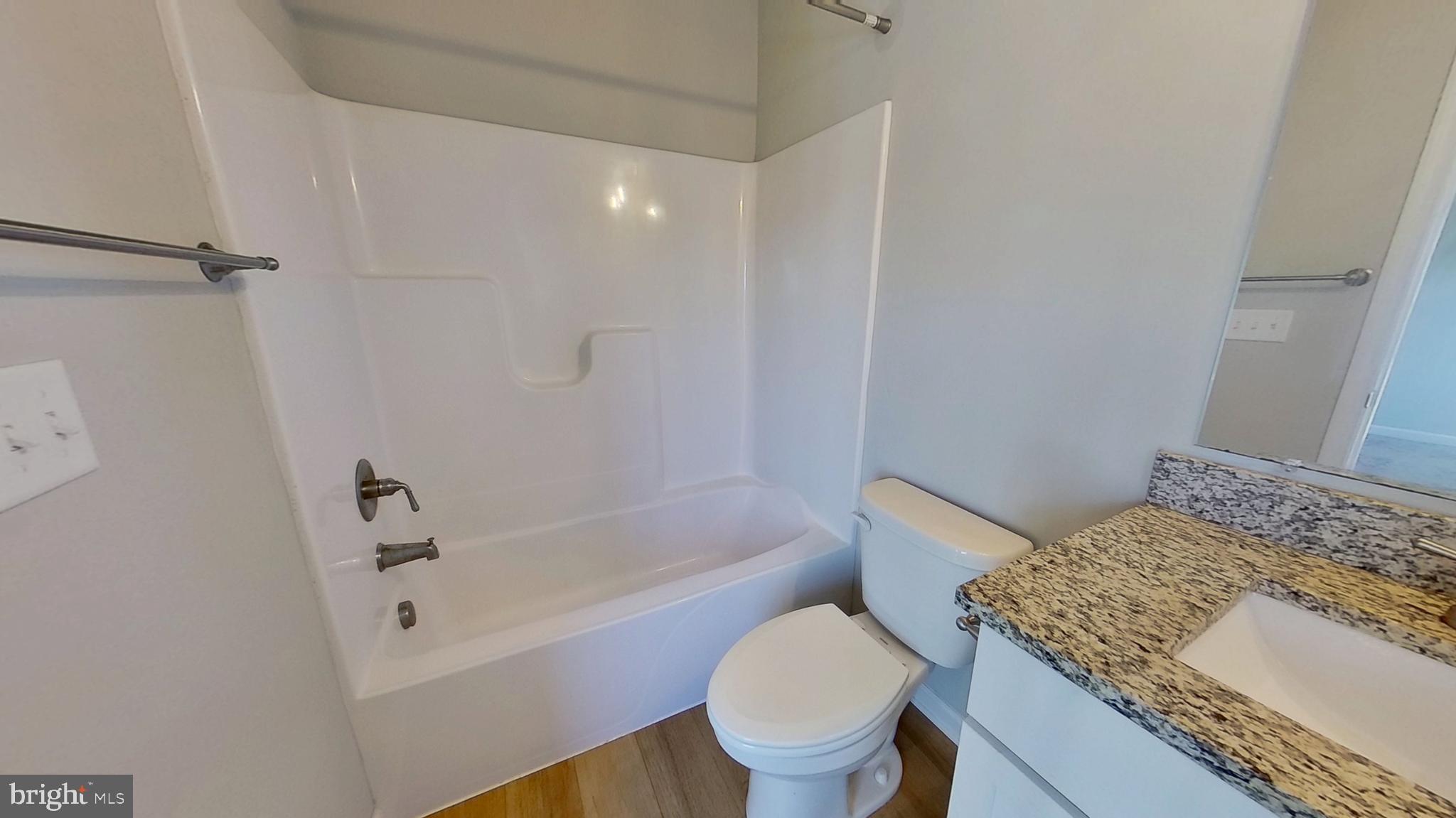 126 Hudson Boulevard Red Lion, PA 17356 - Photo 15 of 15 a bathroom with a granite countertop toilet sink and bathtub