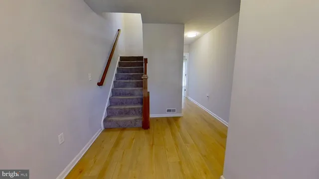 a view of entryway with wooden floor