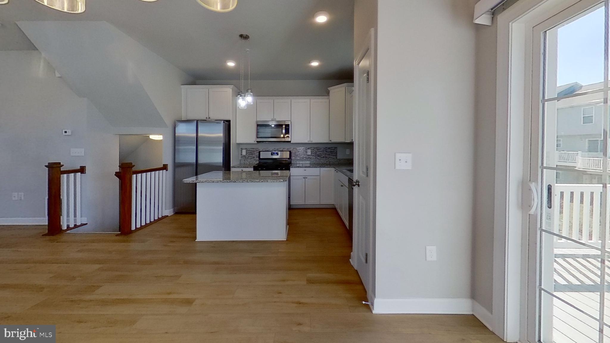 126 Hudson Boulevard Red Lion, PA 17356 - Photo 6 of 15 a view of a kitchen with refrigerator and a counter top space