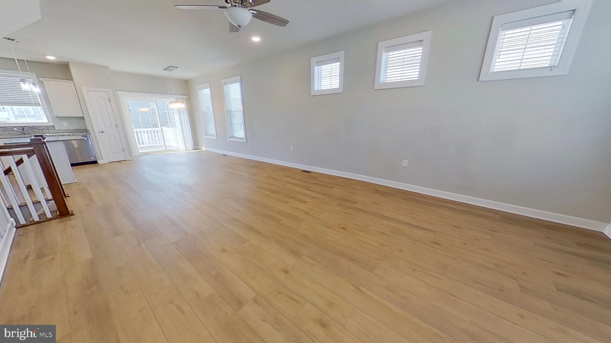 126 Hudson Boulevard Red Lion, PA 17356 - Photo 8 of 15 wooden floor in an empty room with a window