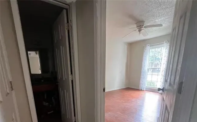 a view of an empty room and a window