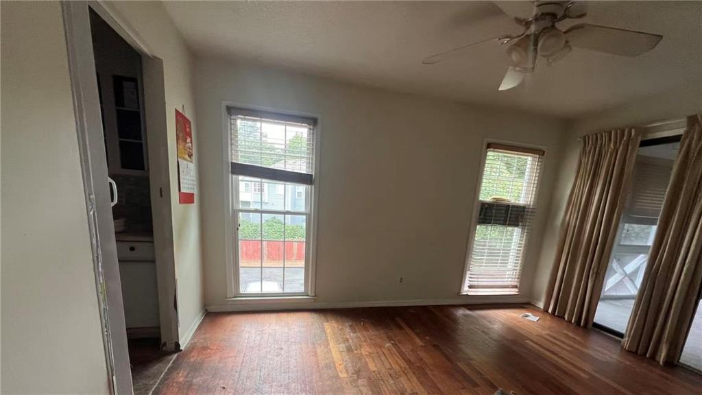1166 Booth Road Southwest, Unit 908 Marietta, GA 30008 - Photo 19 of 32 a view of hallway with window and wooden floor