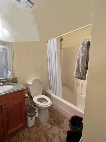 a kitchen with a sink and a stove top oven