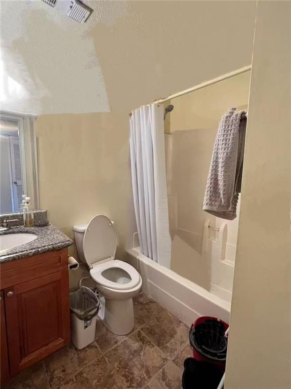 1166 Booth Road Southwest, Unit 908 Marietta, GA 30008 - Photo 24 of 32 a bathroom with a granite countertop toilet sink and mirror