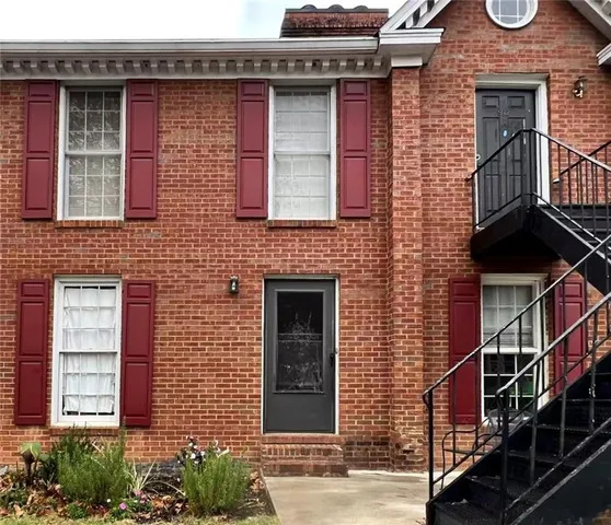 a red brick building with glass windows