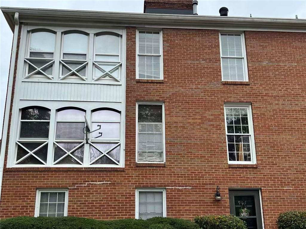 1166 Booth Road Southwest, Unit 908 Marietta, GA 30008 - Photo 31 of 32 a front view of a house