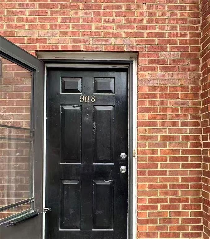 1166 Booth Road Southwest, Unit 908 Marietta, GA 30008 - Photo 4 of 32 a bathroom with a granite countertop shower