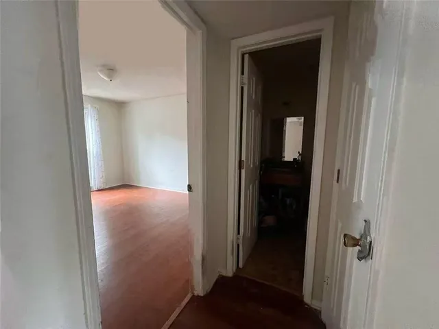 a view of a bathroom from a hallway