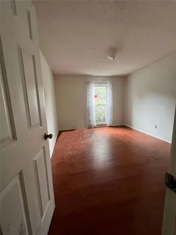 a view of livingroom with window and stairs