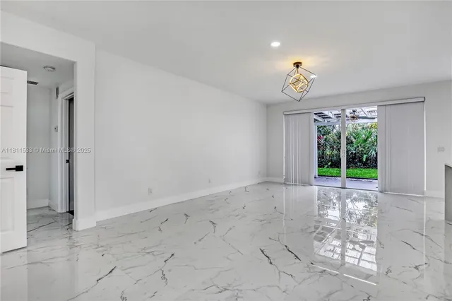 a kitchen with stainless steel appliances a refrigerator and cabinets
