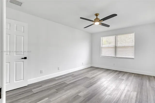 a bathroom with a bathtub and a toilet