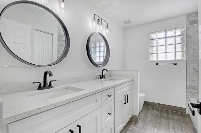 a view of a house with a yard and tree s