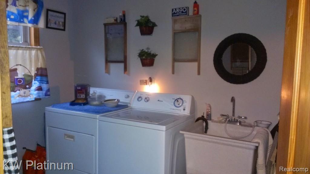7230 Harrington Road Lexington, MI 48450 - Photo 44 of 46 laundry room large enough for side by side wd and sink and folding table.jpg