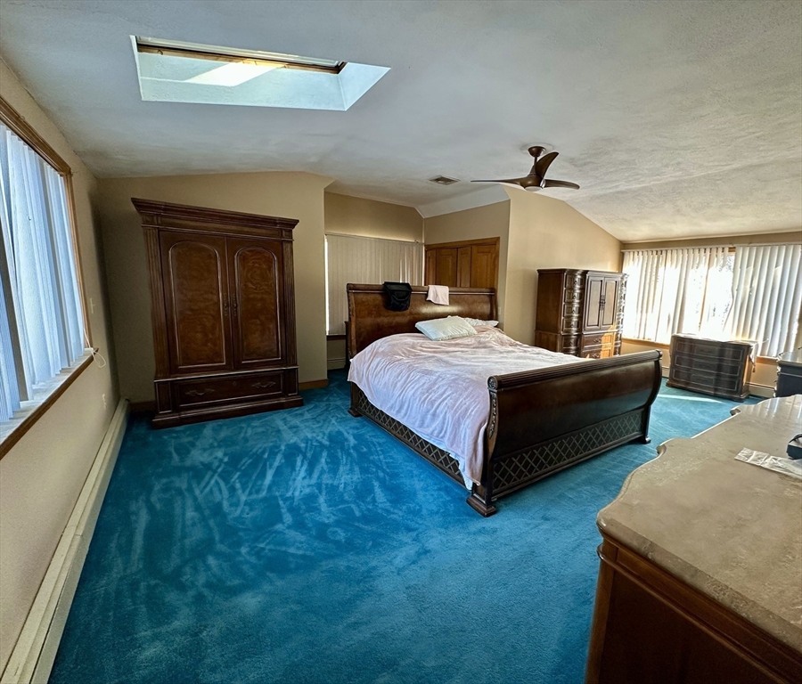 42 Pine Acres Road Foxboro, MA 02035 - Photo 22 of 40 a bedroom with a bed and window