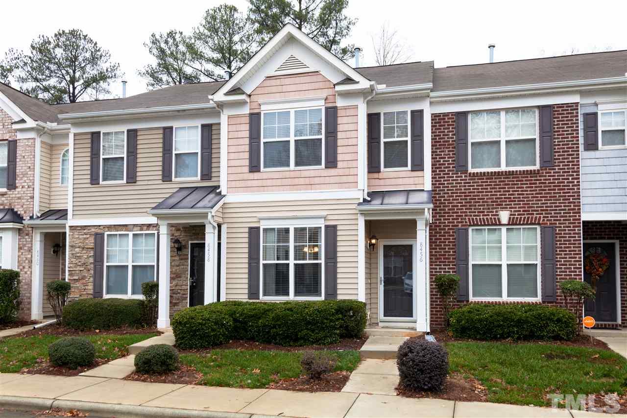 8456 Central Drive Raleigh, NC 27613 - Photo 1 of 25 a front view of a house with a yard and plants