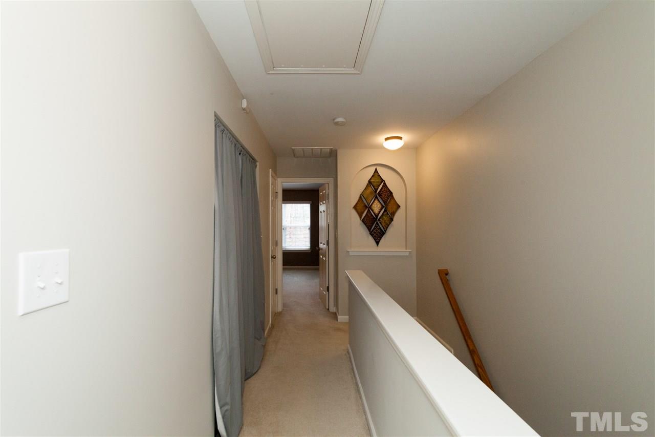 8456 Central Drive Raleigh, NC 27613 - Photo 22 of 25 a view of hallway with stairs
