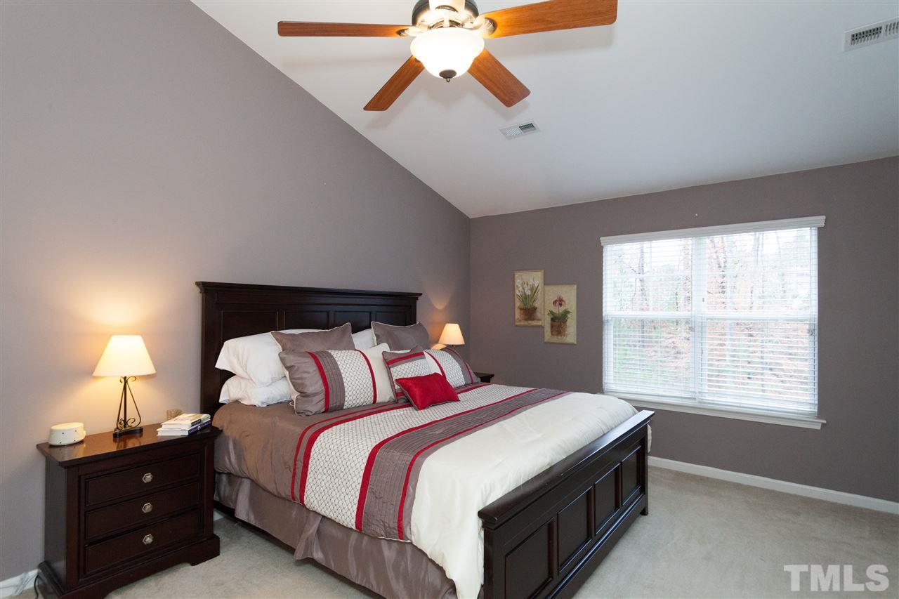 8456 Central Drive Raleigh, NC 27613 - Photo 5 of 25 a bedroom with a bed and a window