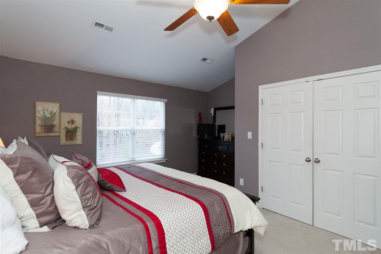 8456 Central Drive Raleigh, NC 27613 - Photo 6 of 25 a bedroom with a bed and a window
