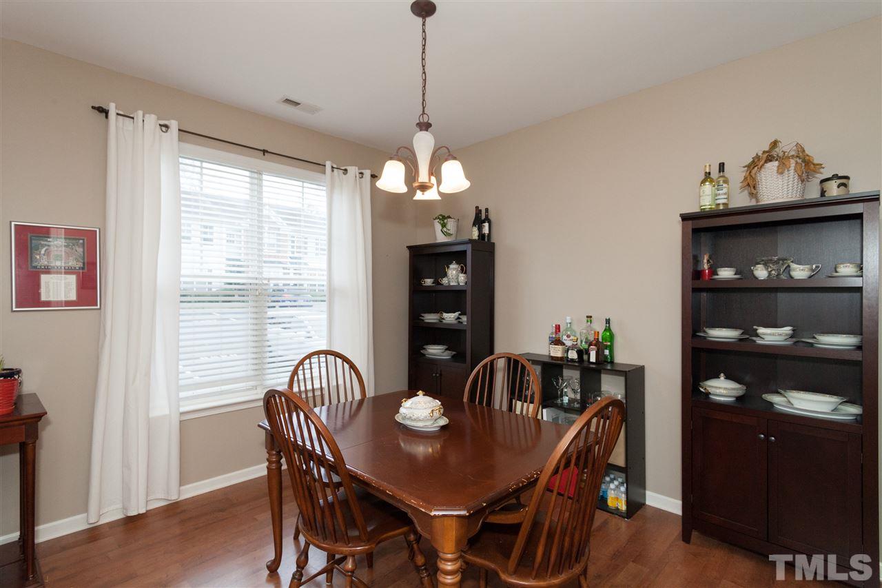 8456 Central Drive Raleigh, NC 27613 - Photo 8 of 25 a dining room with furniture and window