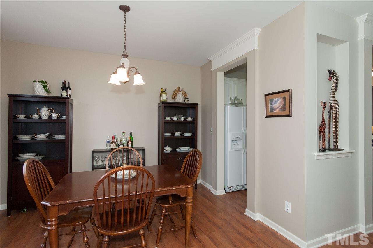 8456 Central Drive Raleigh, NC 27613 - Photo 9 of 25 a dining room with furniture and window