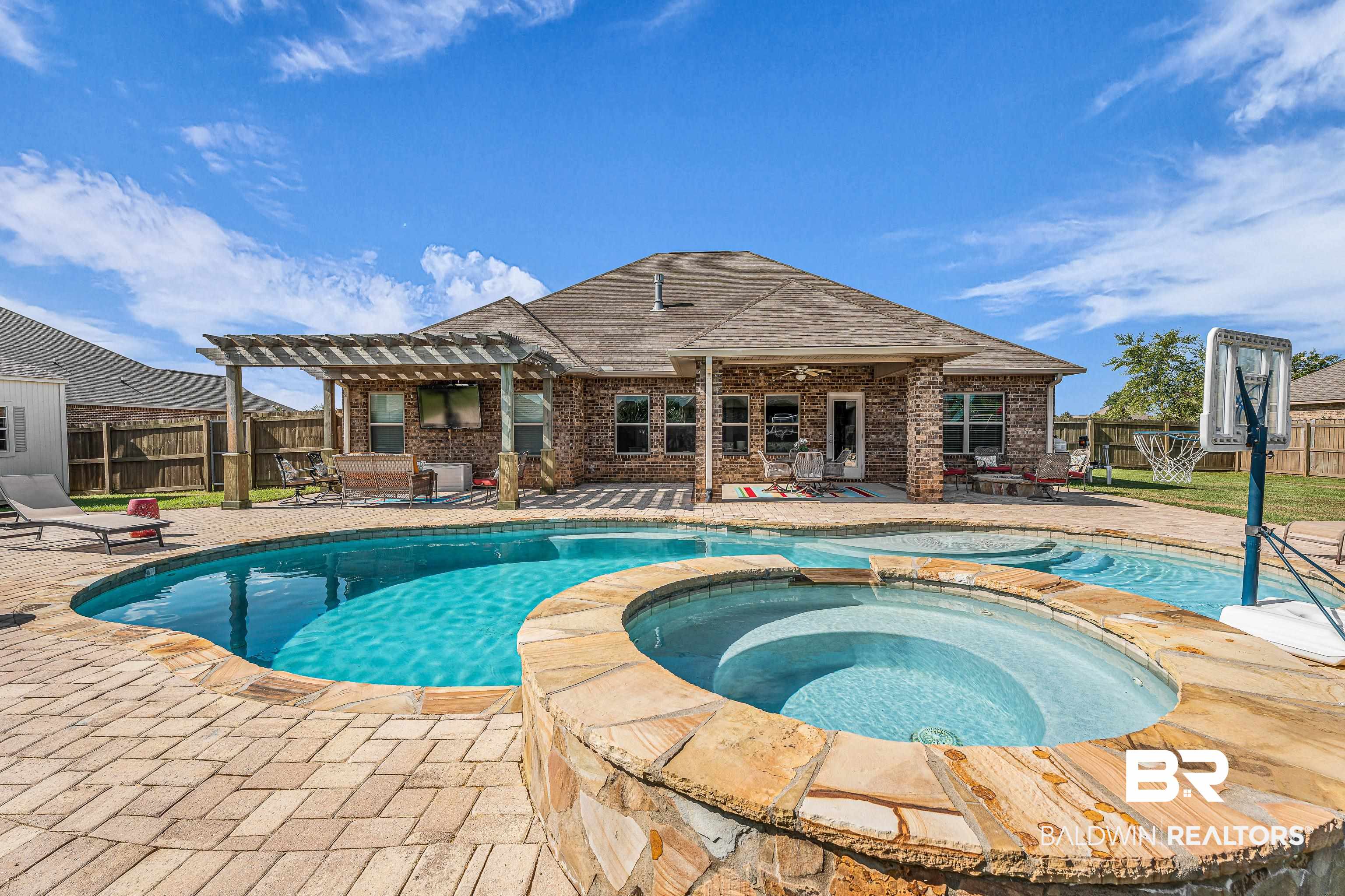 9675 Camberwell Drive Daphne, AL 36526 - Photo 28 of 34 View of swimming pool featuring a pergola, a fenced backyard, and a patio area