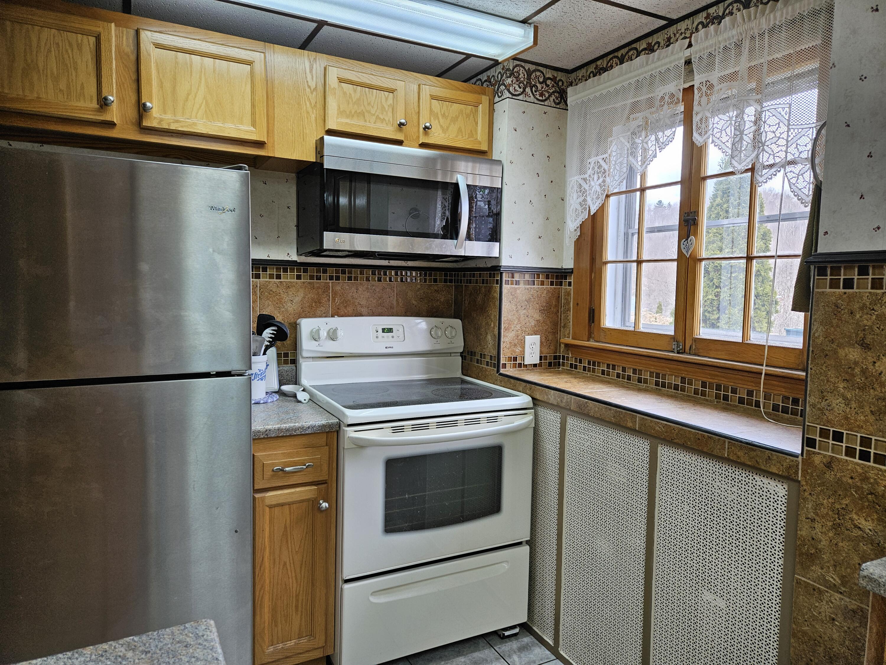 13 Granite Street Mexico, ME 04257 - Photo 12 of 46 Natural sunlight in the kitchen