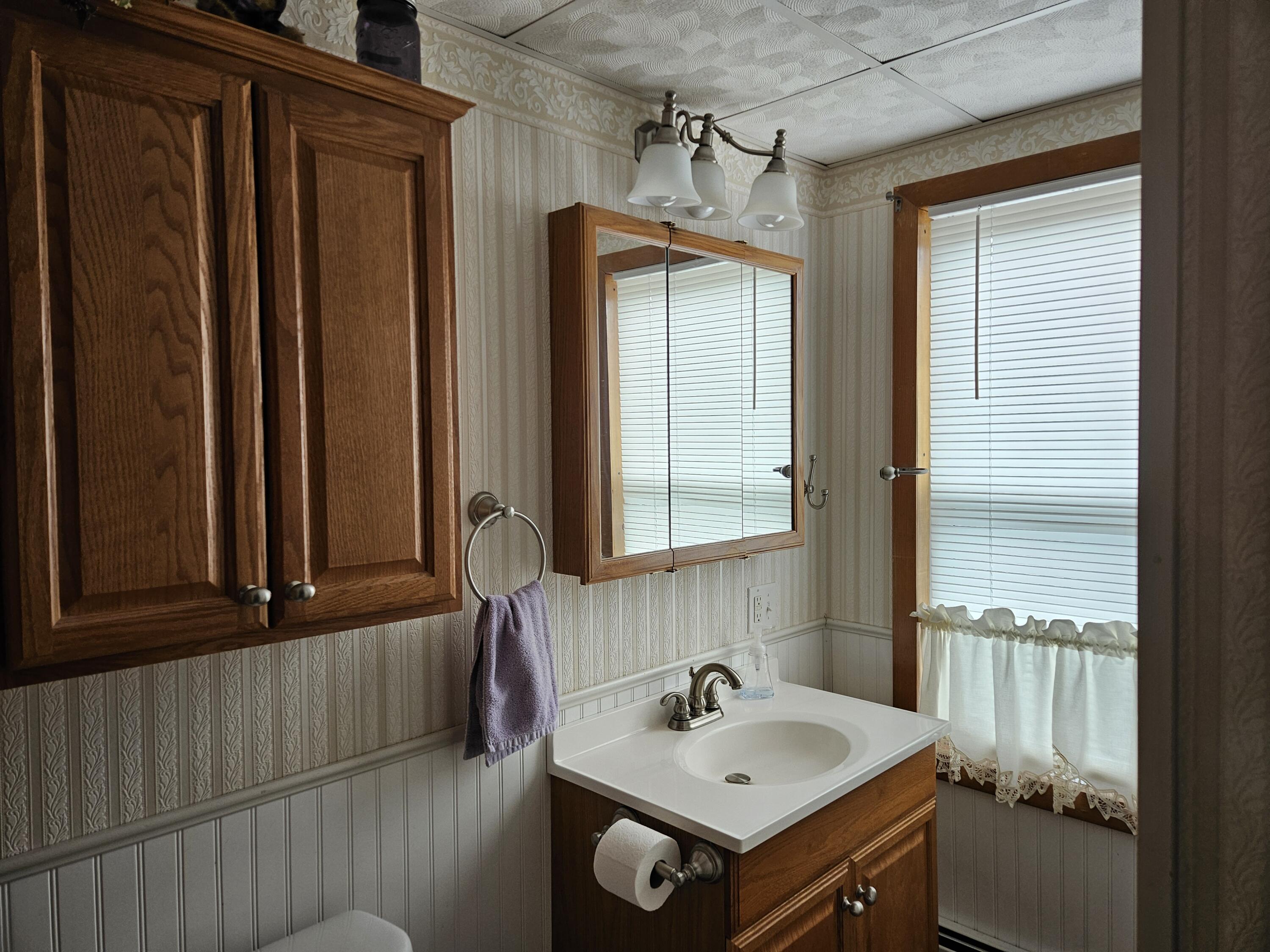 13 Granite Street Mexico, ME 04257 - Photo 13 of 46 1st flr full bathroom
