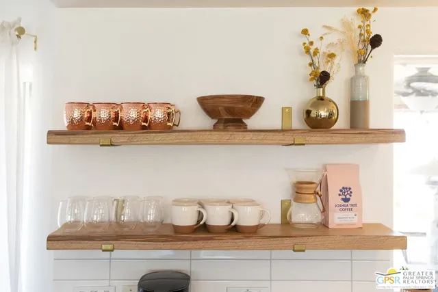 a living room with fireplace furniture and a flat screen tv