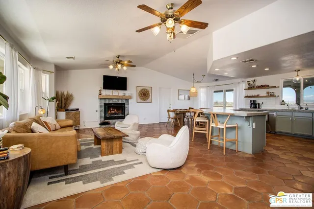 a view of a house with a yard and sitting area